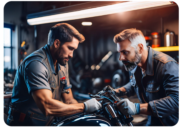People working in a motorcycle workshop